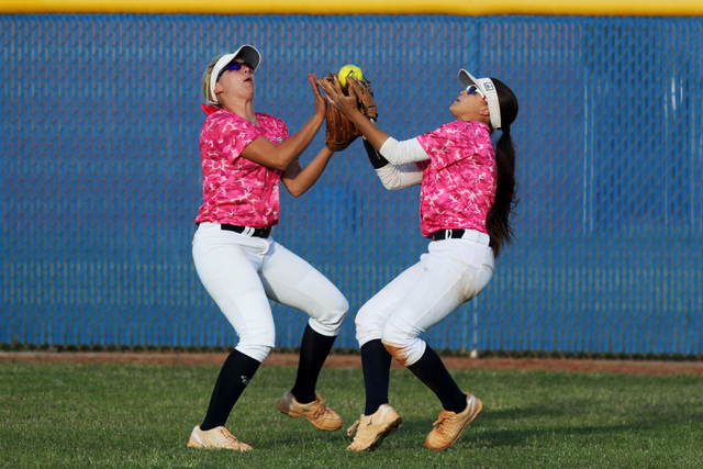 Foothill left fielder Daryan Meade and center fielder Alexis Farias collide and drop a Coron ...