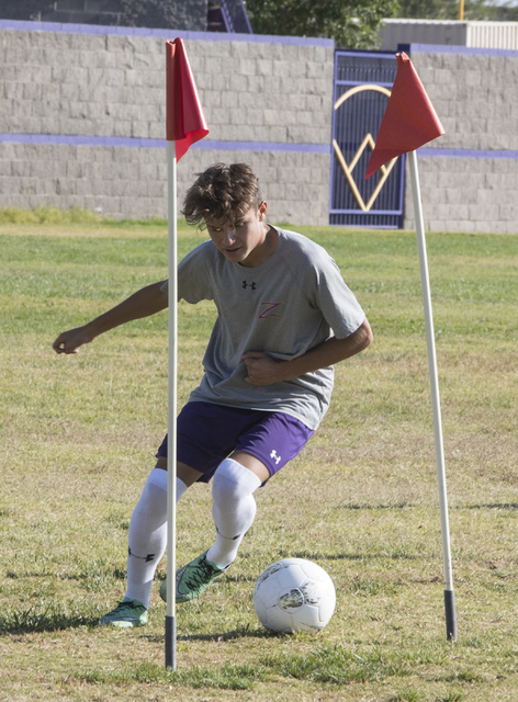 Oscar Rodriguez (12) runs drills during soccer practice at Durango High School in Las Vegas ...