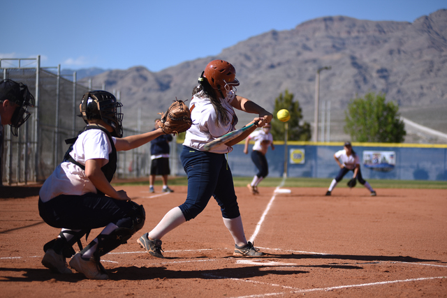 Legacy’s Alyssa Gastelum (14) swings at a pitch against Shadow Ridge during their soft ...