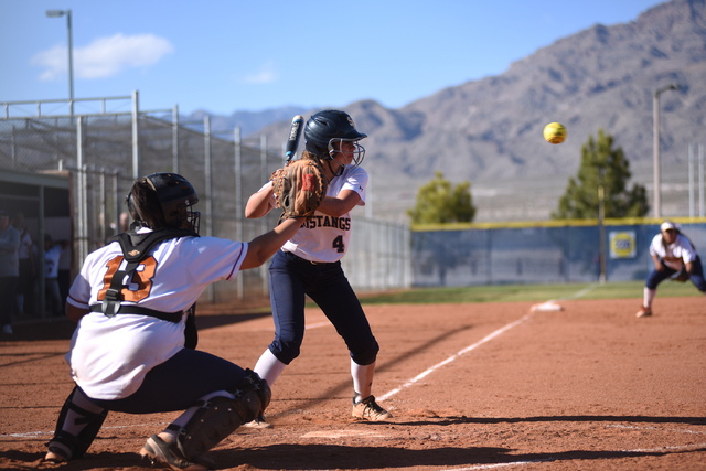 Shadow Ridge’s Sophie Meza (4) looks at a pitch against Legacy during their softball g ...