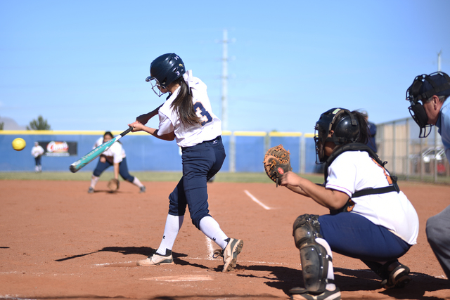 Shadow Ridge’s Marisa Miano (3) swings at a pitch against Legacy during their softball ...