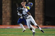 After beating Desert Pines safety Jon McCoy, Moapa Valley’s Kaleb Bodily pulls in a fo ...