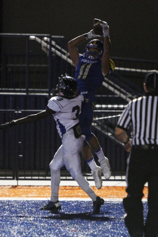 Moapa Valley wide receiver R.J. Hubert pulls in the game-winning touchdown while being cover ...