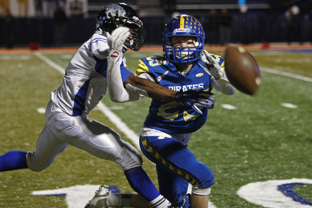 Desert Pines linebacker Isaiah Morris breaks up a pass to Moapa Valley wide receiver Justin ...