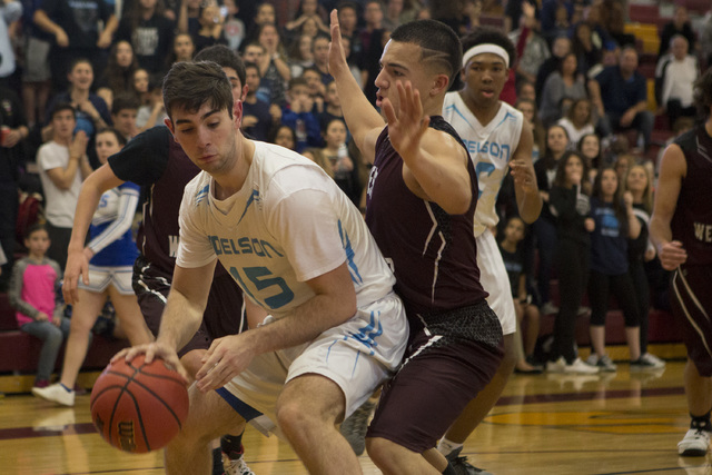 Adelson senior Jake Buchman handles the ball during the 2A boys state semifinal game at Del ...