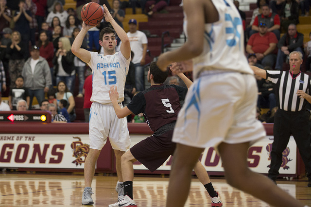 Adelson senior Jake Buchman looks for a teammate to pass to during the 2A boys state semifi ...