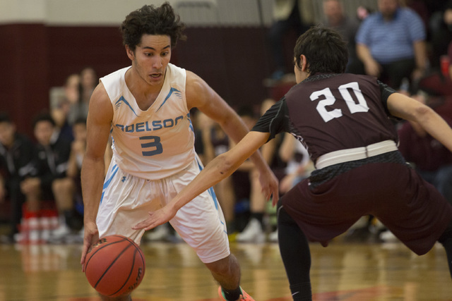 Adelson senior Jacob Elharrar handles the ball during the 2A boys state semifinal game again ...