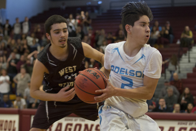 Adelson junior Ben Elharrar take the ball up the court during the 2A boys state semifinal ga ...