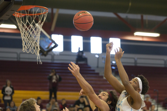 Adelson junior Miles Hagan goes up for a basket during the 2A boys state semifinal game at D ...