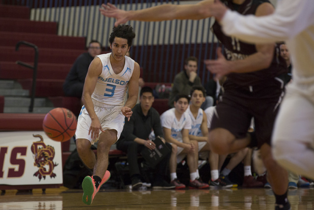 Adelson senior Jacob Elharrar passes the ball during the 2A boys state semifinal game agains ...