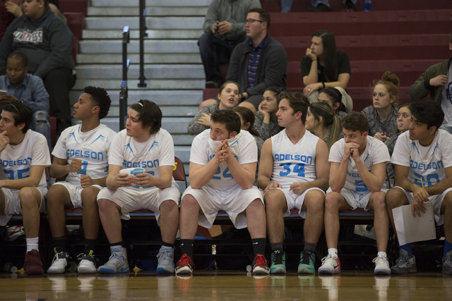 Adelson players nervously watch the game as they enter overtime during the 2A boys state sem ...