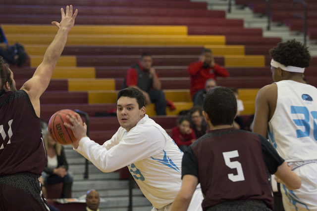 Adelson senior Brandon Pappas looks for a teammate to pass to during the 2A boys state semif ...