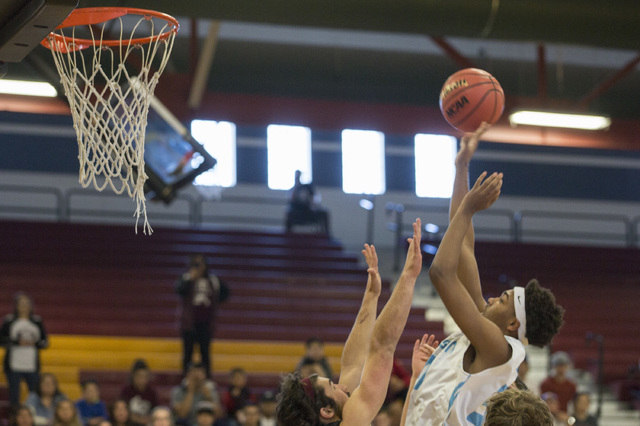 Adelson junior Miles Hagan goes up for a basket during the 2A boys state semifinal game agai ...