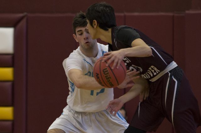 Adelson senior Jake Buchman attempts to steal the ball from West Wendover during the 2A boys ...