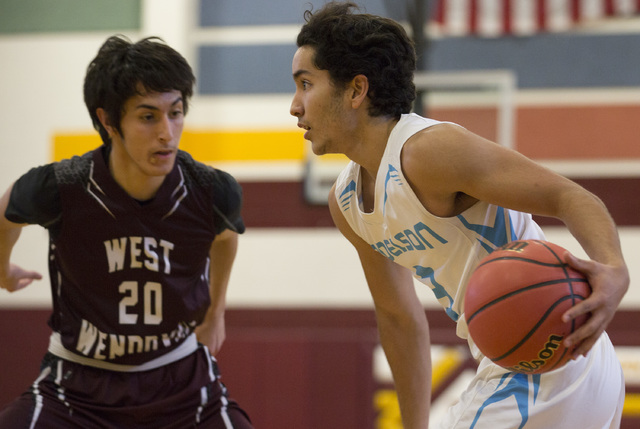 Adelson senior Jacob Elharrar brings the ball to the basket as West Wendover junior Saul Pal ...