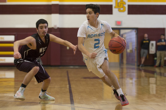 Adelson junior Ben Elharrar attempts to take the ball to the basket during the 2A boys state ...