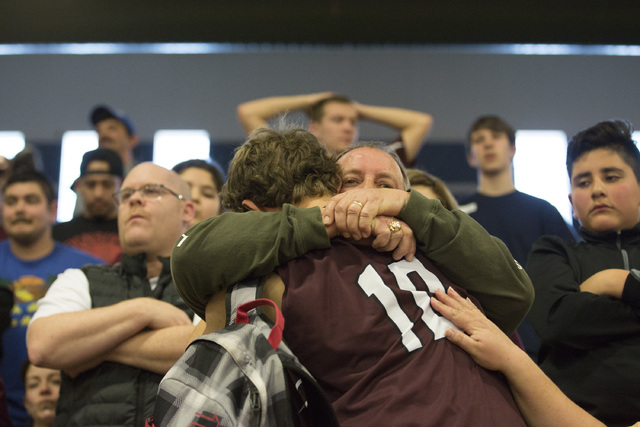 West Wendover senior Braden Price has an emotional moment after loosing to Adelson in overti ...
