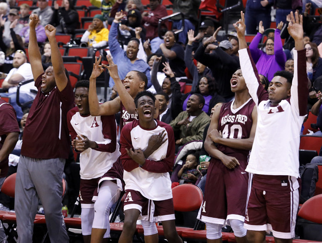 Agassi Prep’s players and coaches react during the second half of a Class 2A boys stat ...
