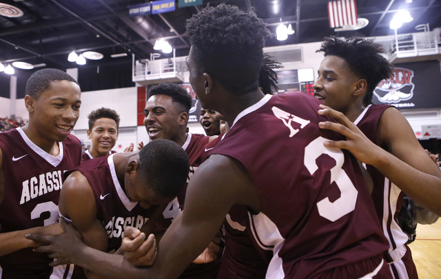 Agassi Prep players react after defeating Adelson School in a Class 2A boyss state final at ...