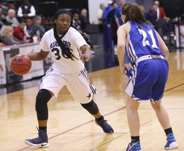 Agassi Prep’s J’Laiya Regan (3) dribbles pass Needle’s Preslee Murch (21) ...