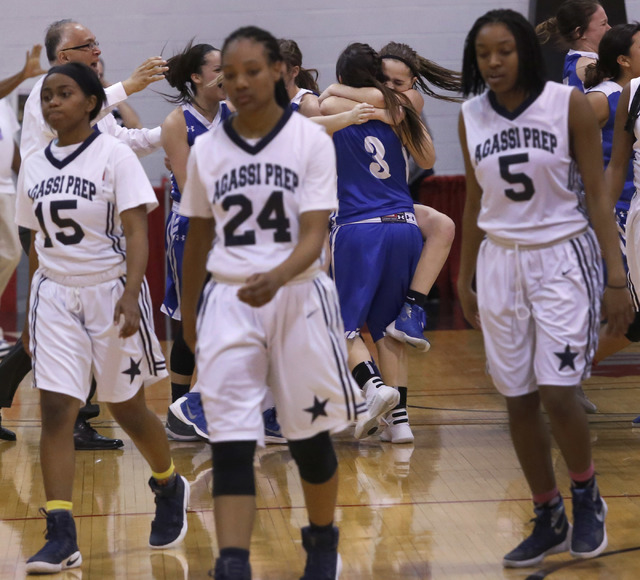 Agassi Prep’s Denise Parker (15), from left, Destiny Rover (24), and Pa’Shun Min ...