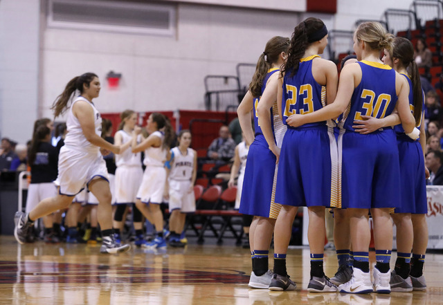 Lowry players huddle during introductions before the first half of a Class 3A girls state se ...