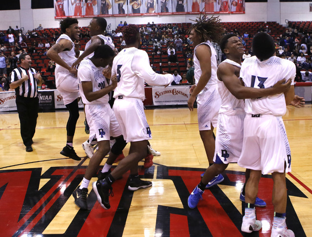 Desert Pines players react after winning a Class 3A boys state final championship game at th ...