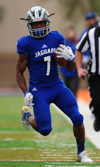 Desert Pines running back Isaiah Morris rushes for a first down against Spring Creek in the ...