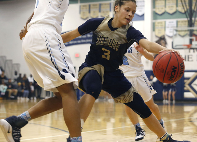 Spring Valley’s Essence Booker (3) recovers a loose ball during the first half of a Cl ...