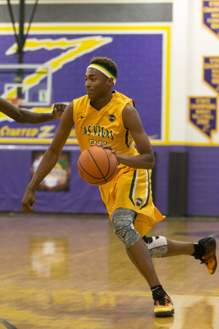 Las Vegas Prospects’ Charles O’Bannon Jr. (25) dribbles the ball to the hoop aga ...