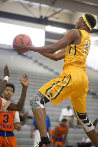 Las Vegas Prospects’ Charles O’Bannon Jr. (25) goes up for a shot against Dream ...