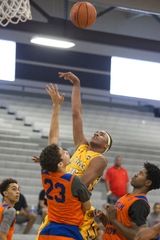 Las Vegas Prospects’ Charles O’Bannon Jr. (25) goes up for a shot against Dream ...
