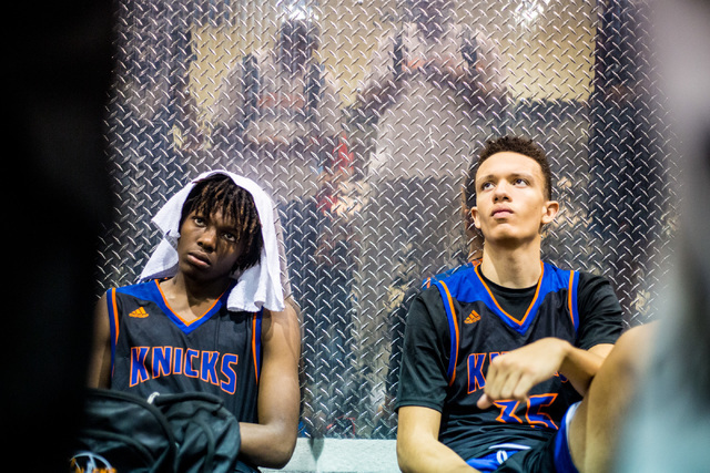 Las Vegas Knicks guard Isaiah Banks, left, and center Darian Scott, listen to feedback after ...