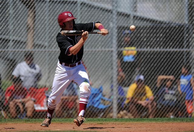 Desert Oasis infielder Chase Adams bunts in two runs in the second inning of their prep base ...