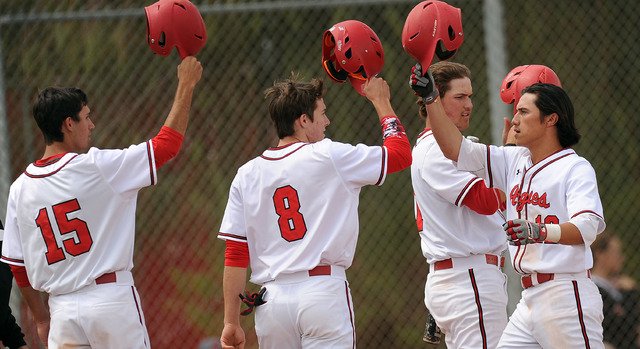 Arbor View’s Nick Quintana, far right, high fives teammates Ryan McHale, Sam Pastrone ...