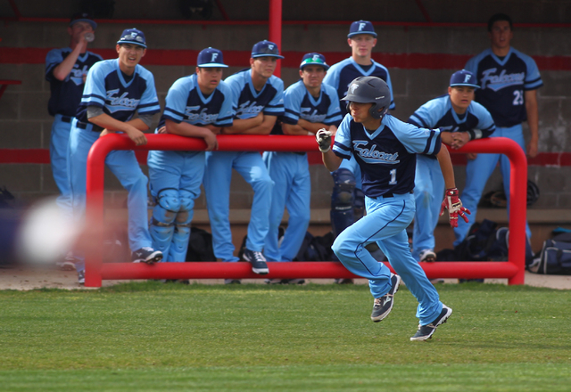 Foothill’s Daniel Ortiz runs for home to score the first run for the Falcons on Thursd ...