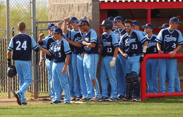 Foothill’s Collin Dobrolecki (24) is congratulated by teammates after hitting a home r ...
