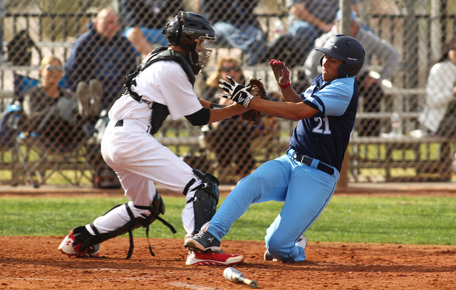 Las Vegas High’s Ryan Freimuth tags out Foothill’s Tyler Van Stone at home in th ...