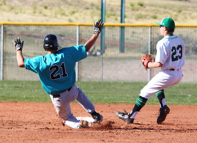 Silverado’s Dillon Johnson (21) slides safely into second base as Palo Verde’s M ...