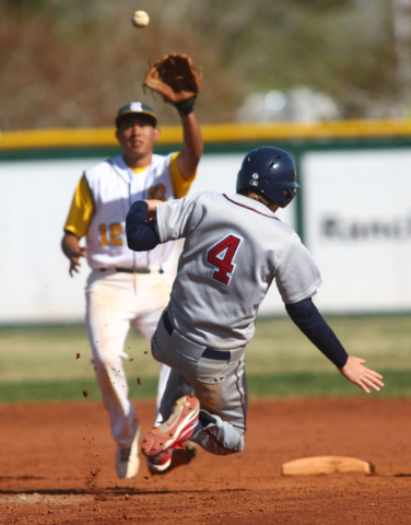Liberty’s Jay Martz (4) attemps to slide safely into second base as Rancho’s Jua ...