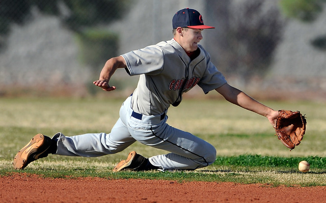 Coronado shortstop Zach Dunham dives for the ball during a game against Shadow Ridge on Mond ...