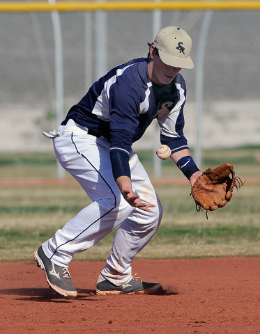 Shadow Ridge shortstop Brady Hoskins bobbles on Monday against Coronado. Hoskins recovered t ...