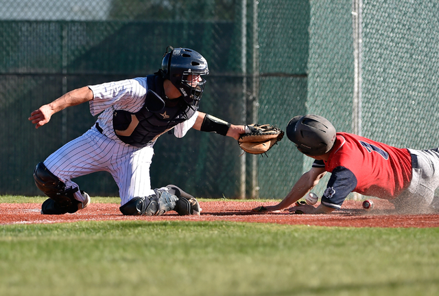 Spring Valley catcher Jake Sellinger, left, drops the ball as he attempts to tag out Coronad ...