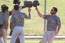 Bonanza’s Keith Werner, right, celebrates with teammates, after hitting a home run aga ...