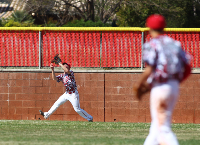Arbor View’s Kevin Johns catches a fly ball off the bat of Faith Lutheran’s Zach ...