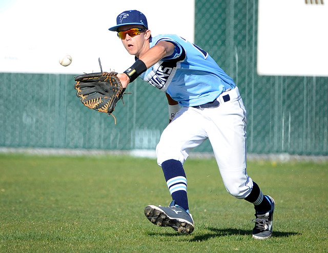 Foothill right fielder Collin Dobrolecki makes a catch against Liberty on Monday. The Falcon ...