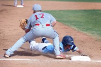 Foothill’s Daniel Hauck slides safely into third base as Liberty’s Josh McCollum ...