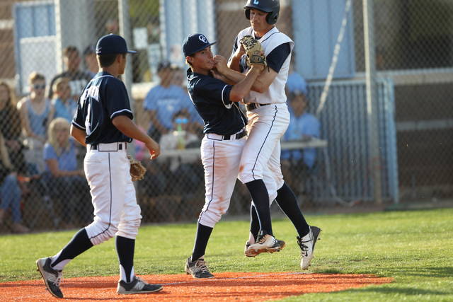 Centennial’s Jared Drizin (29) is tagged out at home base by Chatsworth’s Peter ...