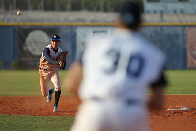 Centennial’s Tanner Wright (11) throws to first base for an out against Chatsworth in ...