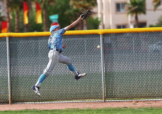 Centennial right fielder Cooper Powell is unable to make a leaping catch on Vincent Taormina ...